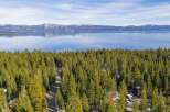 Discover a stunning property nestled amidst a lush forest with breathtaking lake views.