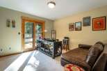 This room offers a dedicated space for music enthusiasts, featuring a DJ setup with turntables and audio equipment.