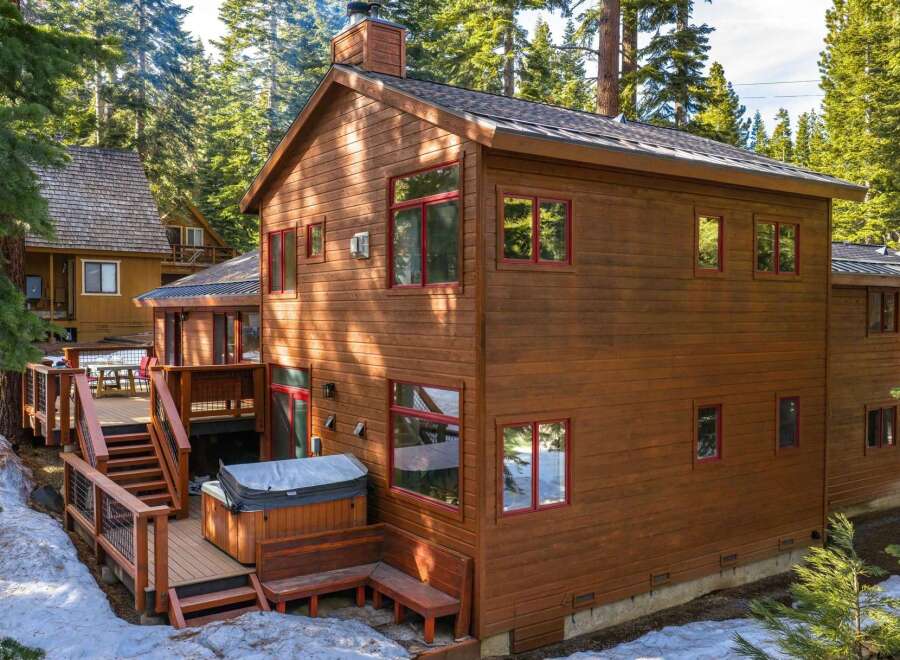 Experience mountain living in this stunning wooden home, nestled amongst tall pine trees.