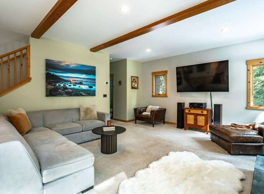Experience cozy living in this inviting living room, featuring a spacious sectional sofa perfect for relaxation and entertainment.