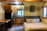 Experience cozy living in this charming studio apartment, featuring a well-equipped kitchenette and a comfortable sleeping area.