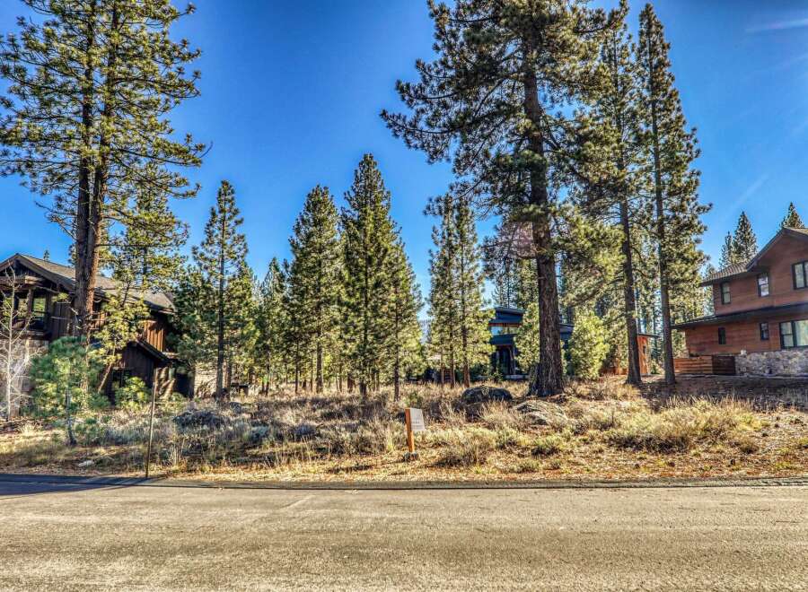 Nestled amidst towering pines, this stunning property offers a serene escape.