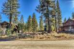 Nestled amidst towering pines, this stunning property offers a serene escape.