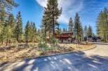 Nestled amidst towering trees, this stunning property offers a serene escape.