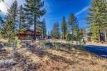 Discover the charm of this stunning property nestled amidst towering trees and a serene landscape.