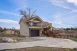 Discover this stunning property featuring a spacious two-story home with a charming balcony and a convenient garage.