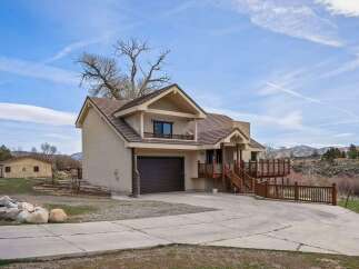 Discover this stunning property featuring a spacious two-story home with a charming balcony and a convenient garage.