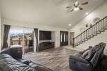 This stunning property boasts a spacious living area with a modern entertainment setup, perfect for relaxation and gatherings.
