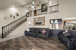 This stunning property boasts a spacious living area with a modern design and high ceilings.