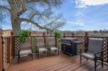 Enjoy outdoor living at its finest on this beautiful deck! Featuring a built-in grill and comfortable seating, this space is perfect for entertaining or relaxing.