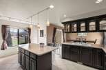 This stunning kitchen boasts a spacious island with ample storage, perfect for meal prep and entertaining.
