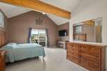 This stunning bedroom boasts a cozy fireplace, perfect for those chilly evenings.