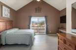 This stunning bedroom offers a serene retreat with breathtaking mountain views visible through the large sliding glass doors.