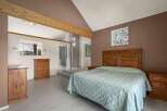 Step into this inviting bedroom, featuring a spacious layout and a cozy atmosphere.