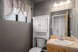 This charming bathroom features a bright and airy design, perfect for starting your day.