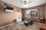 This inviting room features a cozy rocking chair and ottoman, perfect for relaxation.