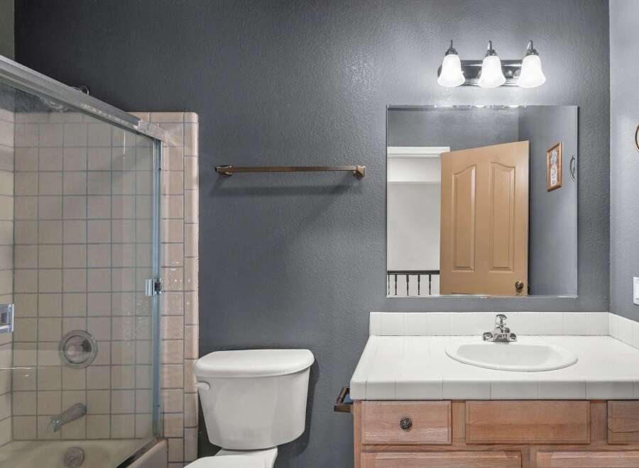 Step into this inviting bathroom featuring a sleek glass shower enclosure and a classic white toilet.
