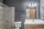 Step into this inviting bathroom featuring a sleek glass shower enclosure and a classic white toilet.