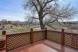 Enjoy breathtaking views from this charming property! This home features a spacious deck with a beautiful lattice railing, perfect for relaxing and taking in the surrounding scenery.