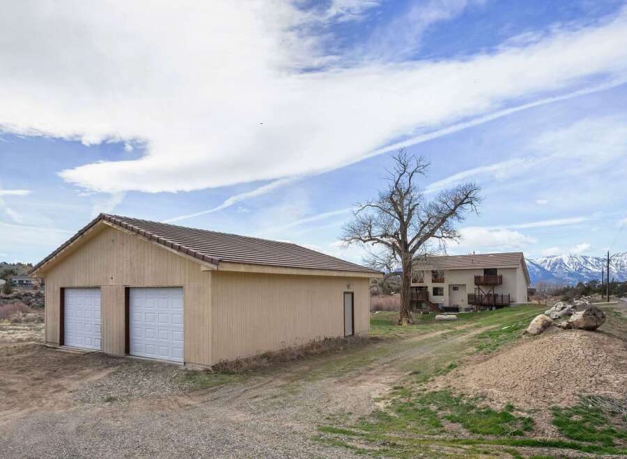Discover this stunning property featuring a spacious garage, perfect for storing vehicles and equipment.
