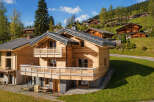 Discover the charm of this stunning wooden chalet nestled in a picturesque mountain setting.