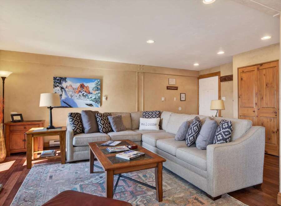 This inviting living room features a comfortable sectional sofa, perfect for relaxing after a long day.