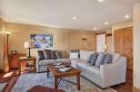 This inviting living room features a comfortable sectional sofa, perfect for relaxing after a long day.
