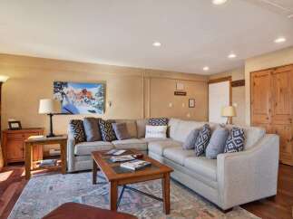 This inviting living room features a comfortable sectional sofa, perfect for relaxing after a long day.