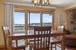 Enjoy breathtaking mountain views from this charming dining room.
