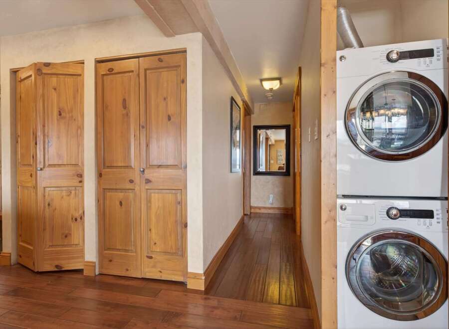 Step into this inviting space, featuring beautiful wooden floors and ample storage.