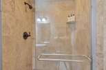 Step into luxury with this stunning shower! Featuring elegant tile work and modern fixtures, this space offers a spa-like experience.