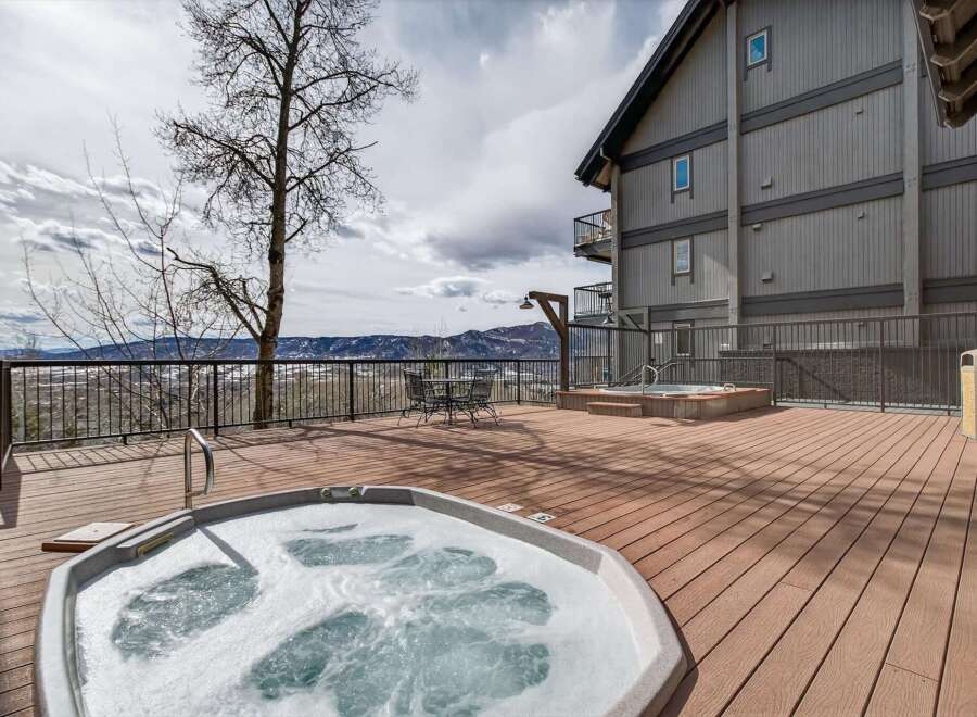 Enjoy breathtaking mountain views from this luxurious property featuring a private hot tub.