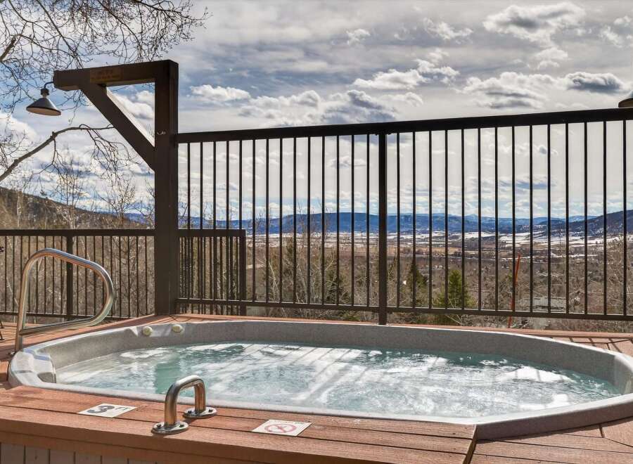 Enjoy breathtaking mountain views from this luxurious hot tub.