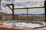 Enjoy breathtaking mountain views from this luxurious hot tub.