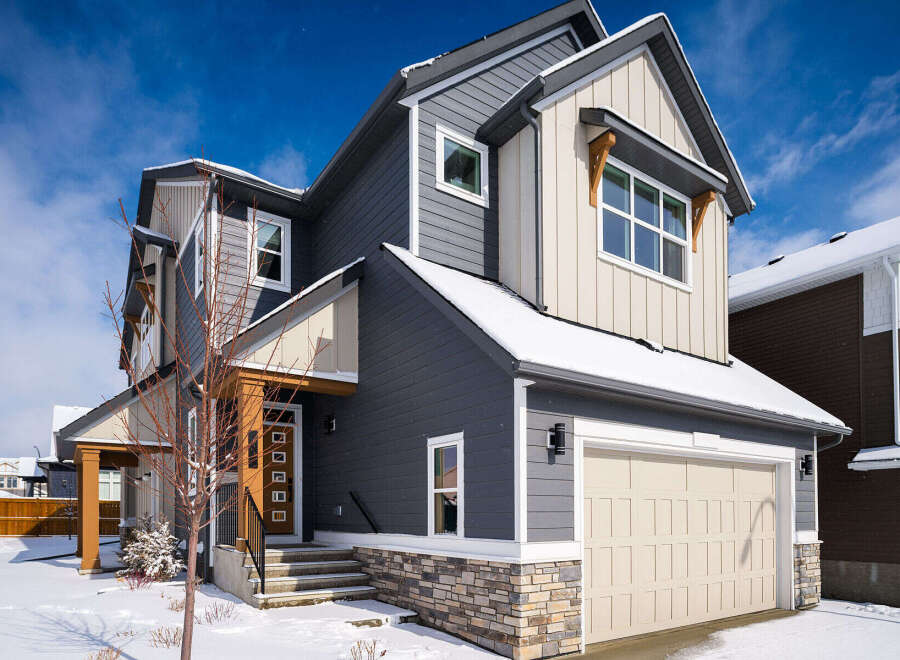 This stunning two-story home boasts a modern design with a beautiful exterior.