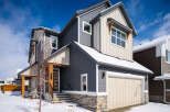This stunning two-story home boasts a modern design with a beautiful exterior.
