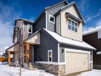 This stunning two-story home boasts a modern design with a beautiful exterior.