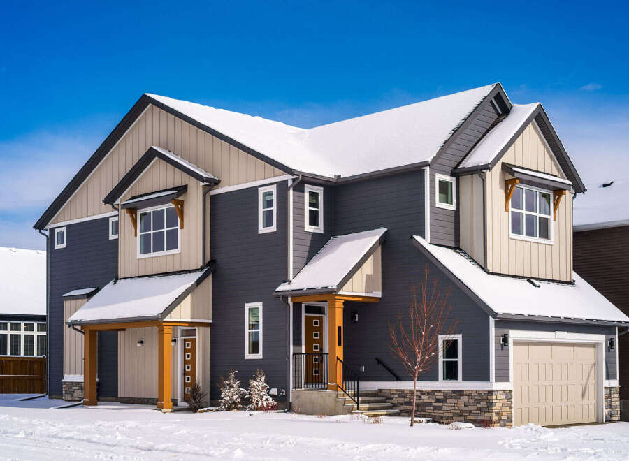 This stunning two-story home boasts a modern design with a beautiful exterior.