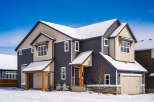 This stunning two-story home boasts a modern design with a beautiful exterior.