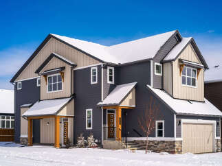This stunning two-story home boasts a modern design with a beautiful exterior.