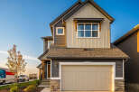 This stunning two-story home boasts a modern design with a neutral color palette.