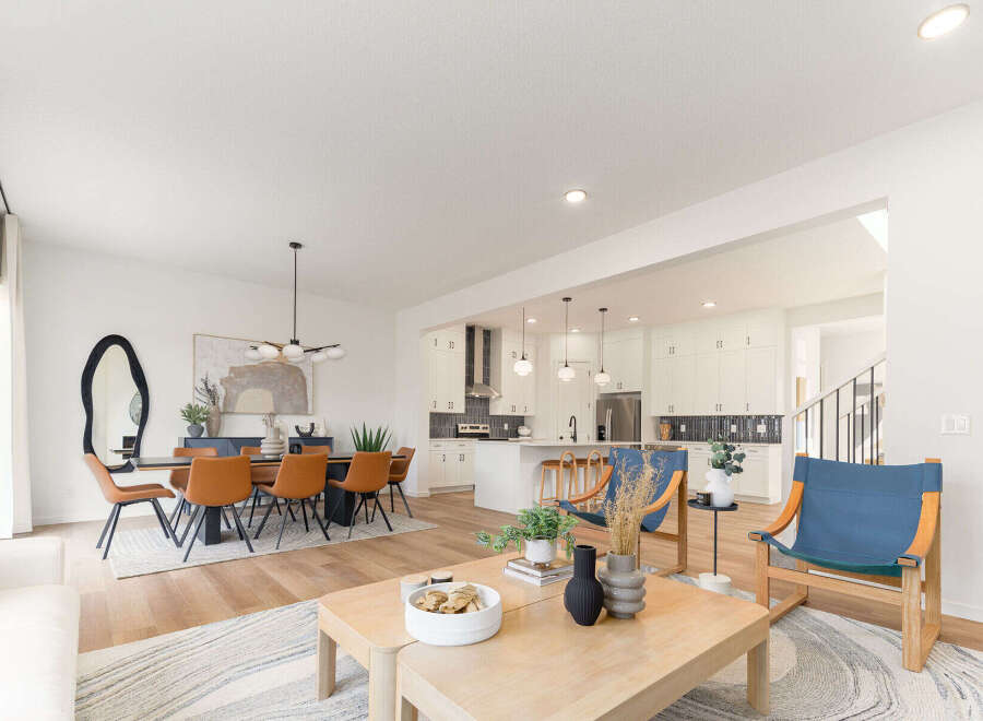 Step into modern elegance with this stunning property, showcasing an open-concept living space perfect for entertaining.