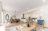 Step into modern elegance with this stunning property, showcasing an open-concept living space perfect for entertaining.