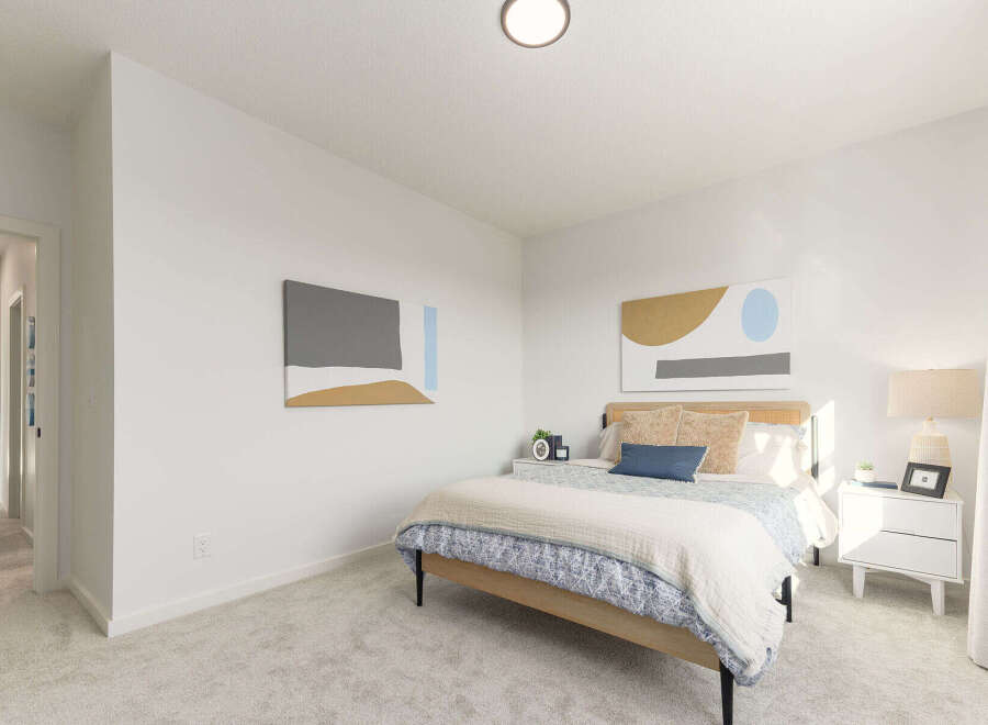 This stunning bedroom offers a serene retreat with its modern design and ample natural light.