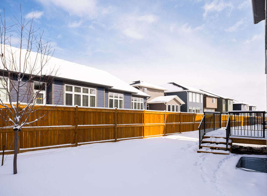 This stunning property boasts a beautiful backyard, perfect for enjoying the winter season.