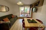 Discover this charming property featuring a cozy living area with a comfortable sofa and stylish decor.