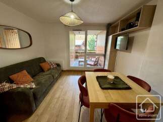 Discover this charming property featuring a cozy living area with a comfortable sofa and stylish decor.