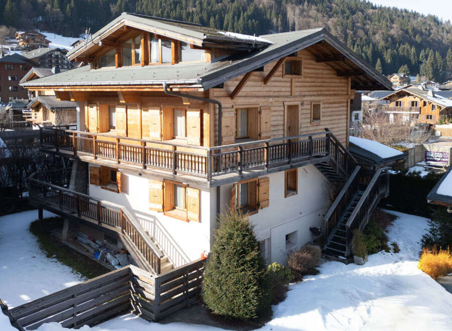 Discover the charm of this stunning wooden chalet nestled in a picturesque mountain setting.