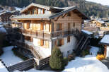 Discover the charm of this stunning wooden chalet nestled in a picturesque mountain setting.