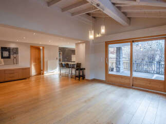 Step into this stunning property featuring a spacious, light-filled living area with beautiful wooden floors.